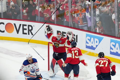 Sergei Bobrovsky and Sam Reinhart celebrate after winning the NHL hockey final 